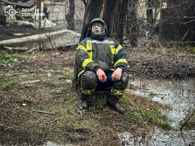 An exhausted Ukrainian emergency services responder during t