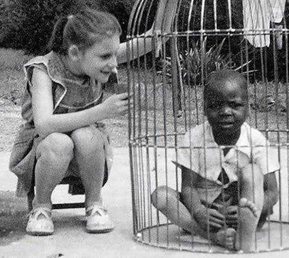 An African infant on exhibit in 1958 at the Human Zoo in Bru